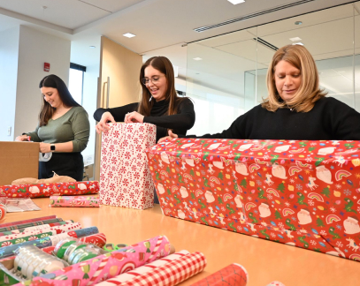 coworkers wrapping presents