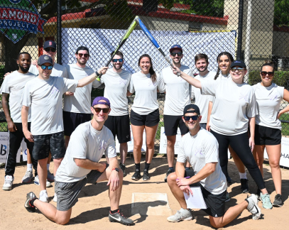 coworkers at a softball field